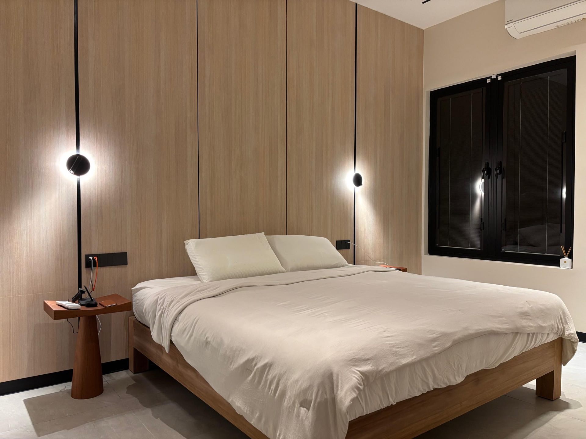 Master bedroom with soft fabrics and bespoke wardrobes